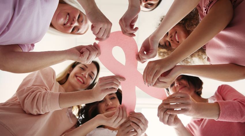 women frm all ages and cultures supporting each other for breast wellness